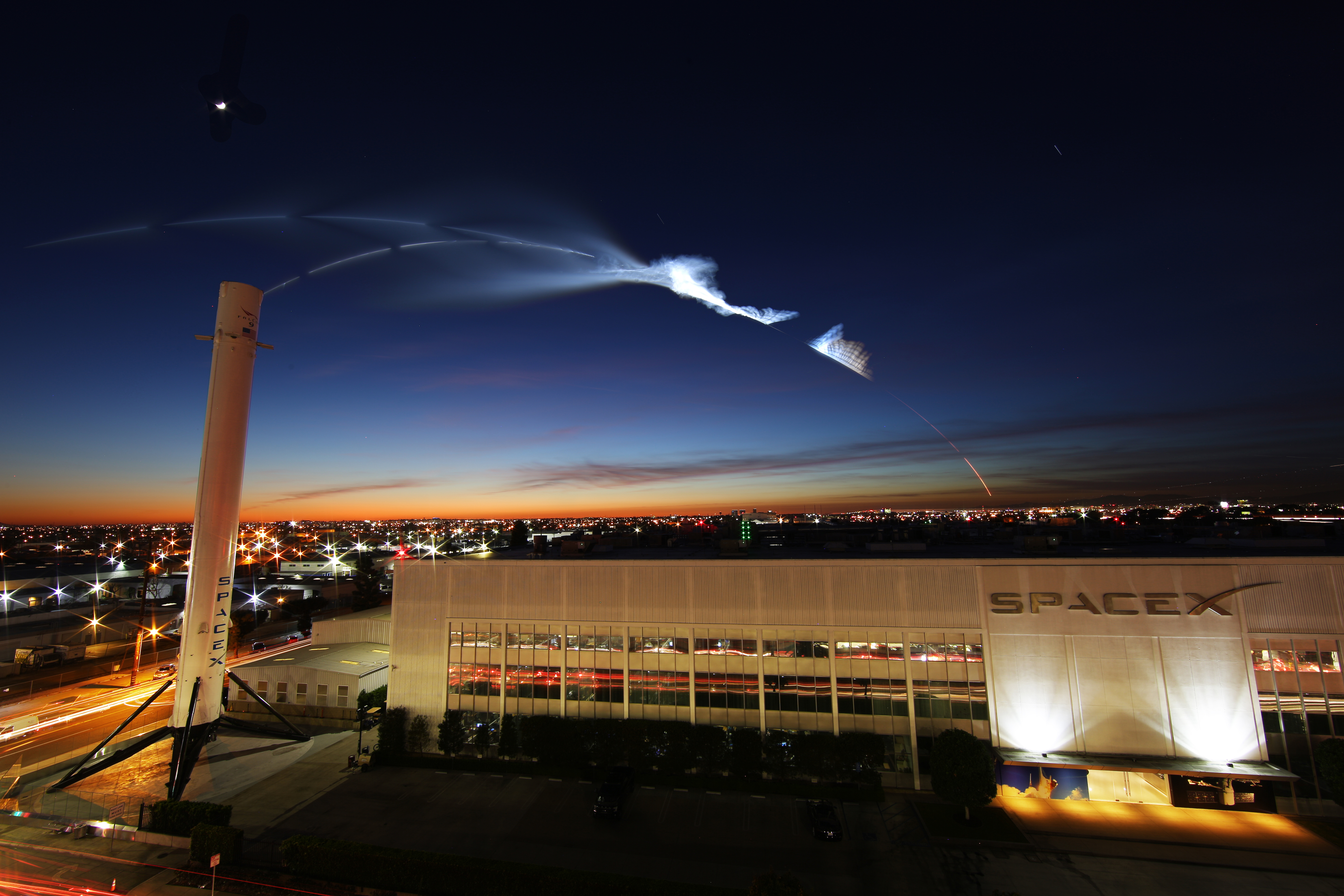 Twilight reflected off of high-altitude rocket exhaust leaves a trail to the stars over SpaceX HQ in Hawthorne, CA