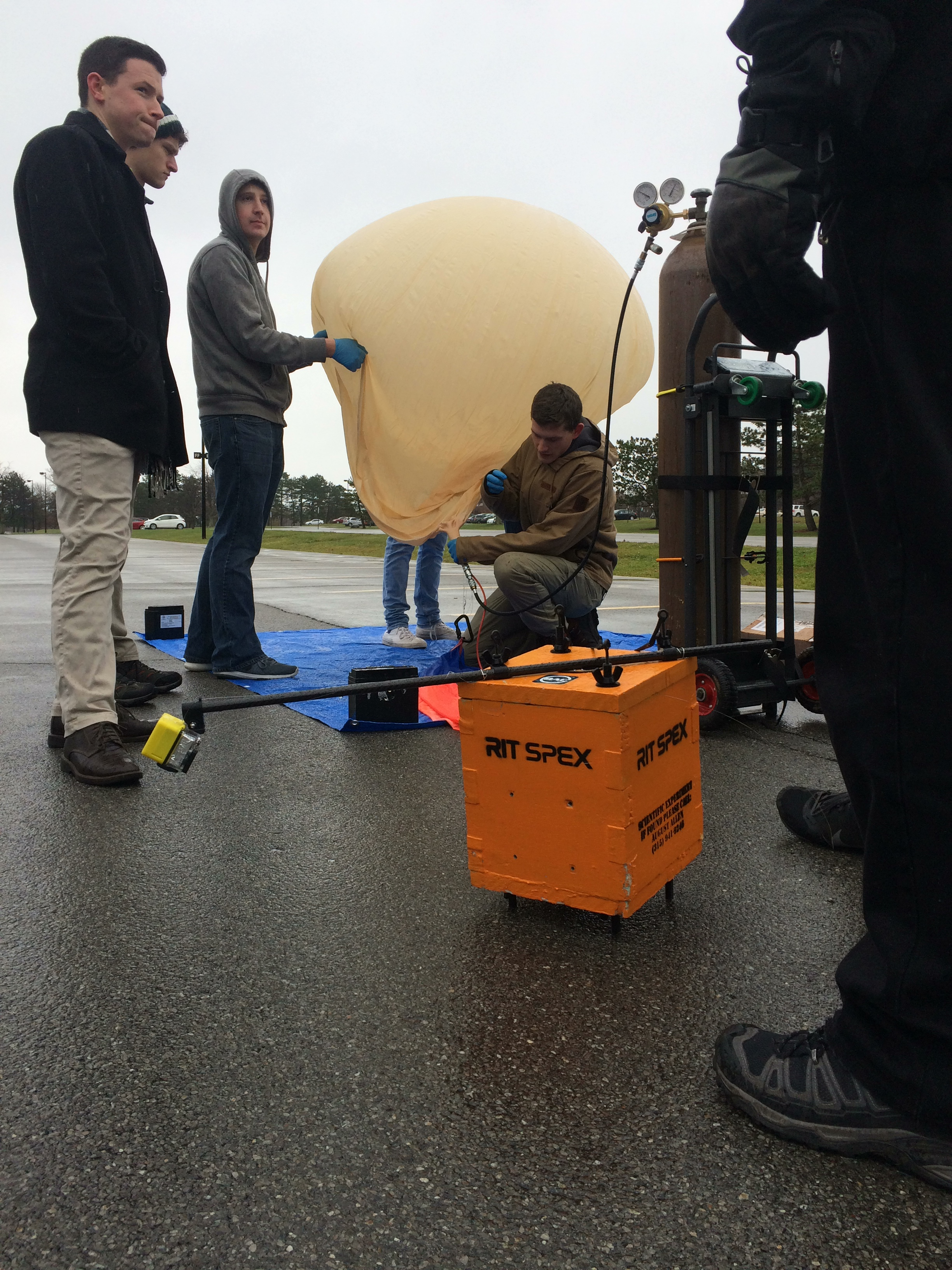 SPEX members hold down the balloon, while preparing to launch HAB3